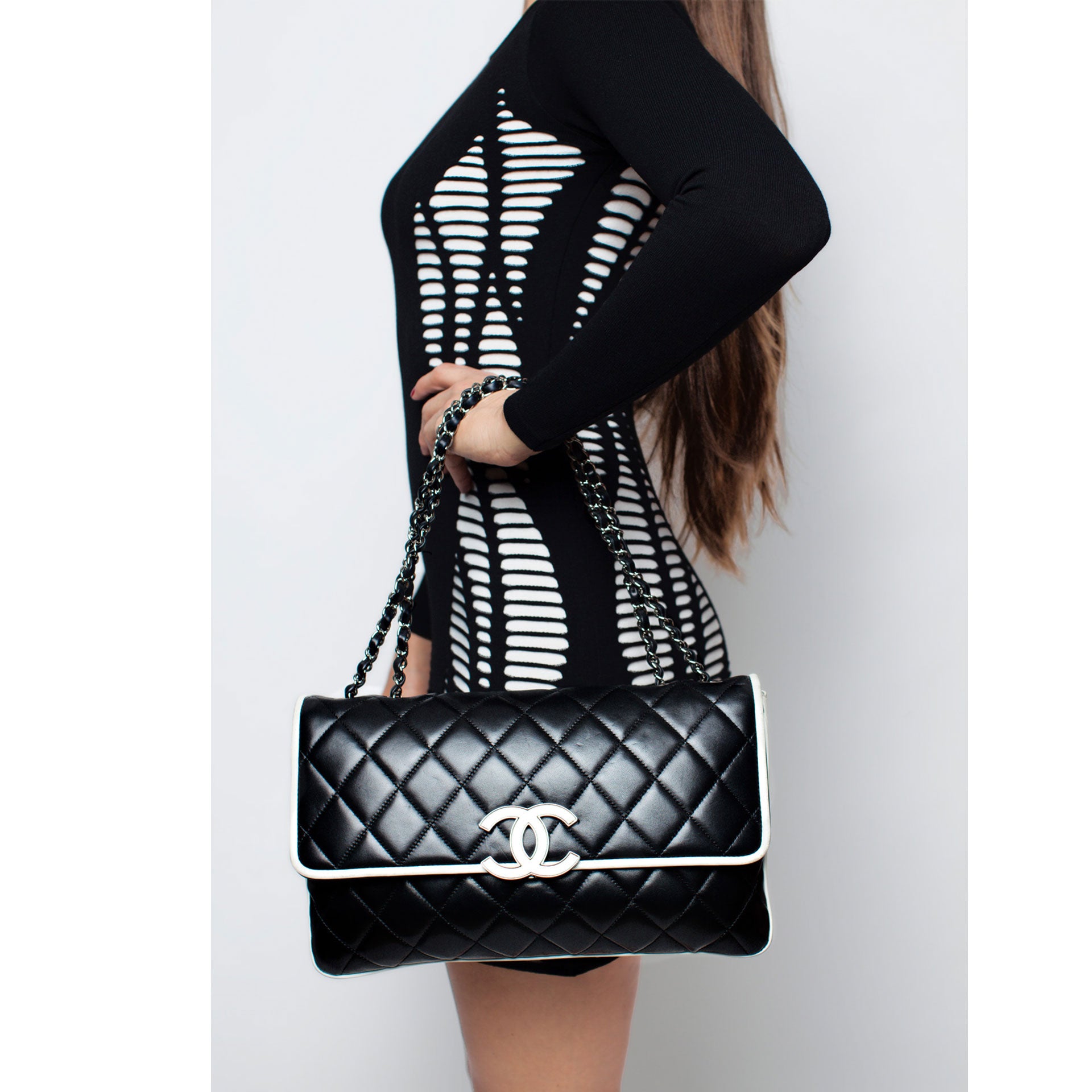 Discover the CHANEL Lambskin & Gold Metal Black & White Cruise