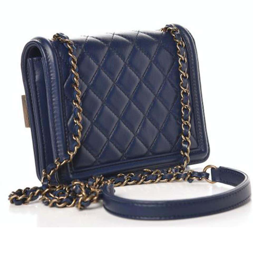 Discover the CHANEL Small Classic Box with Chain Navy Blue Métiers